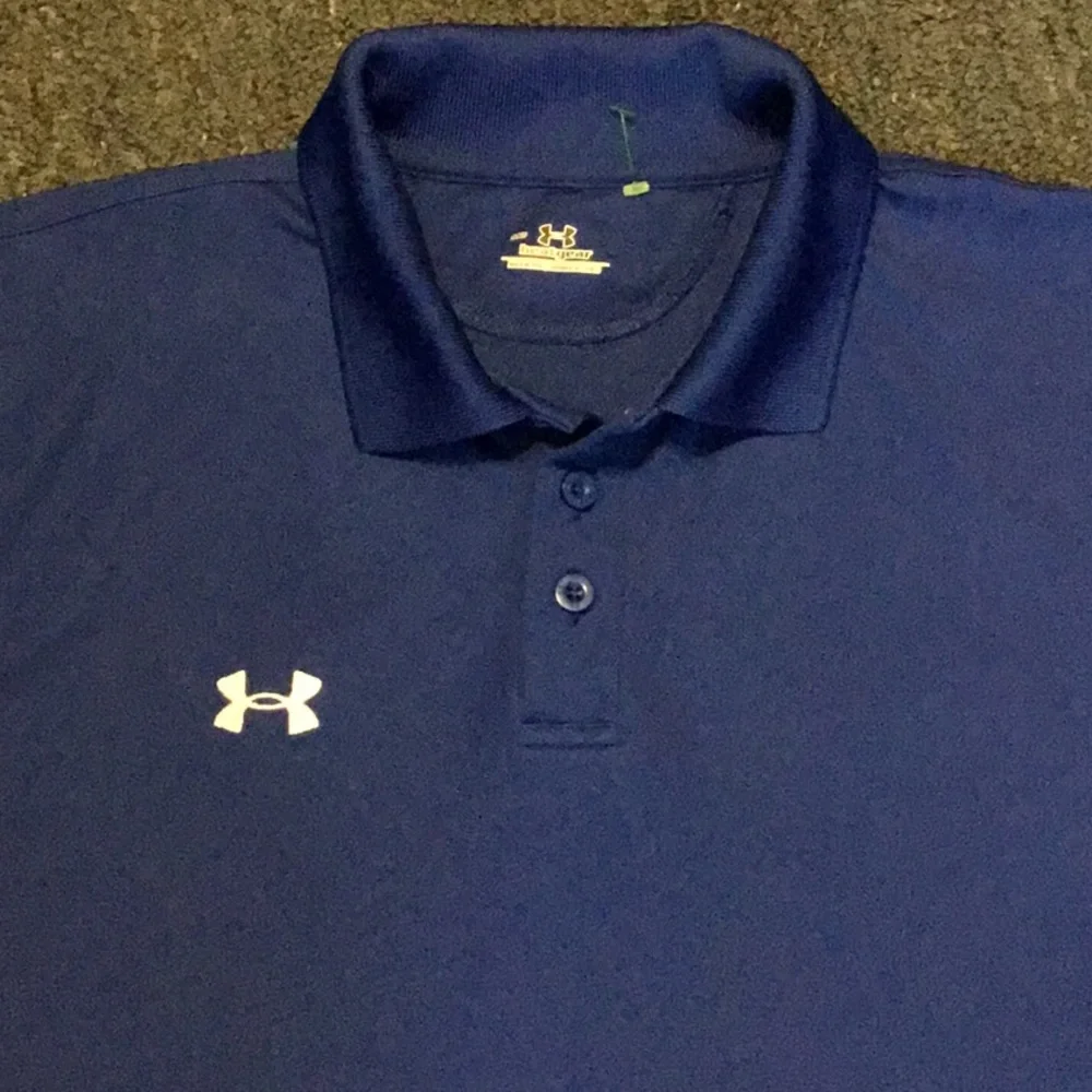 UNDER ARMOUR GOLF SHIRT.